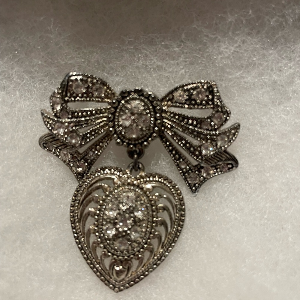 Elegant Silver Bow and Heart Pendant